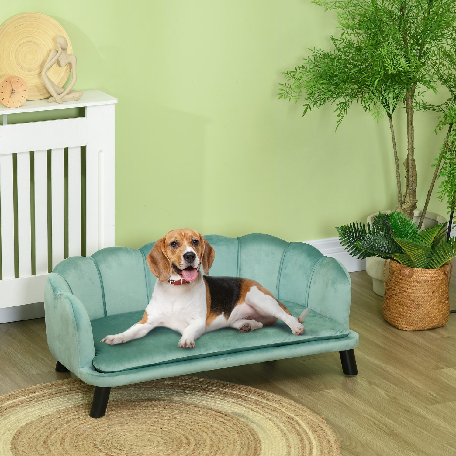 Green PawHut pearl-shell-shaped dog sofa with birch wood legs and a beagle resting in a UK sitting room