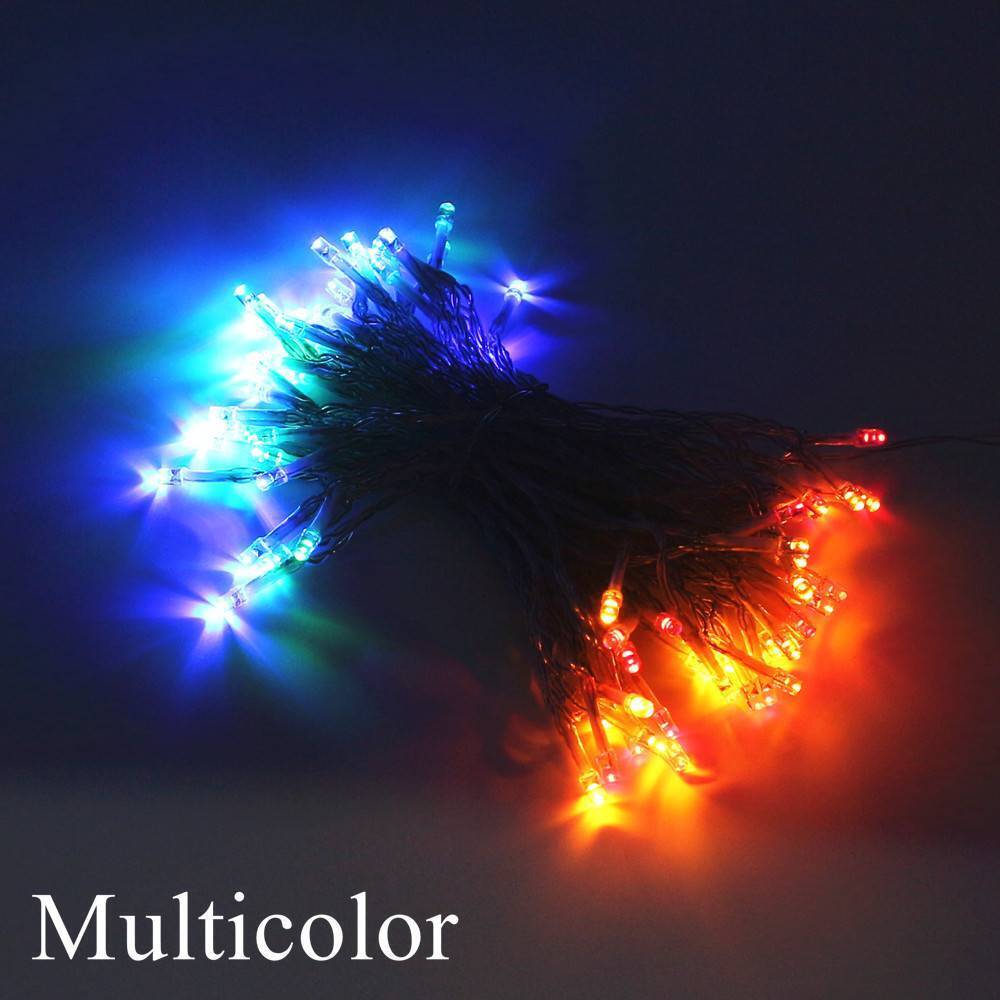 Multicolour fairy lights laid flat on a desk
