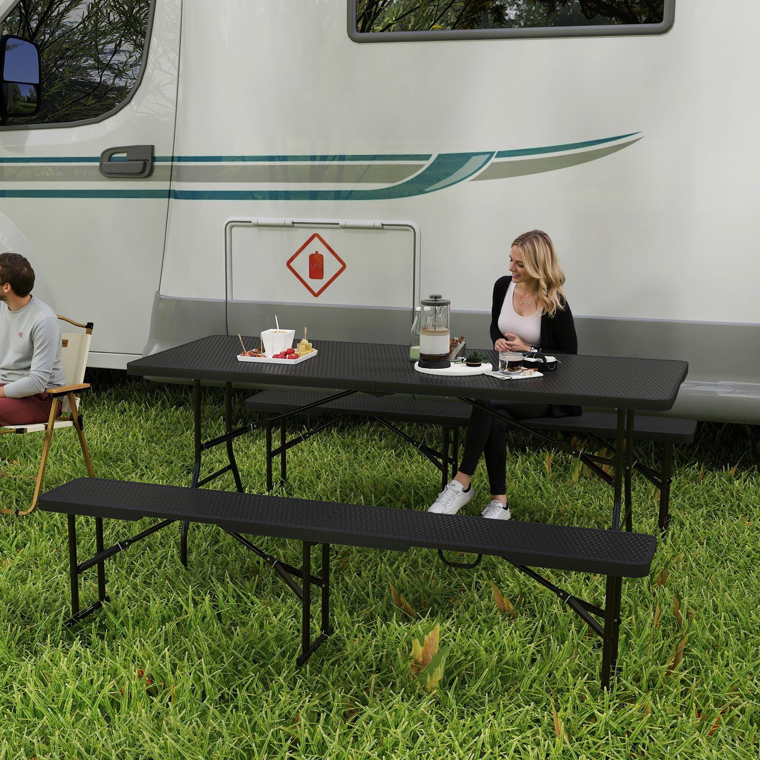 Rattan-effect folding picnic table and bench set on grass